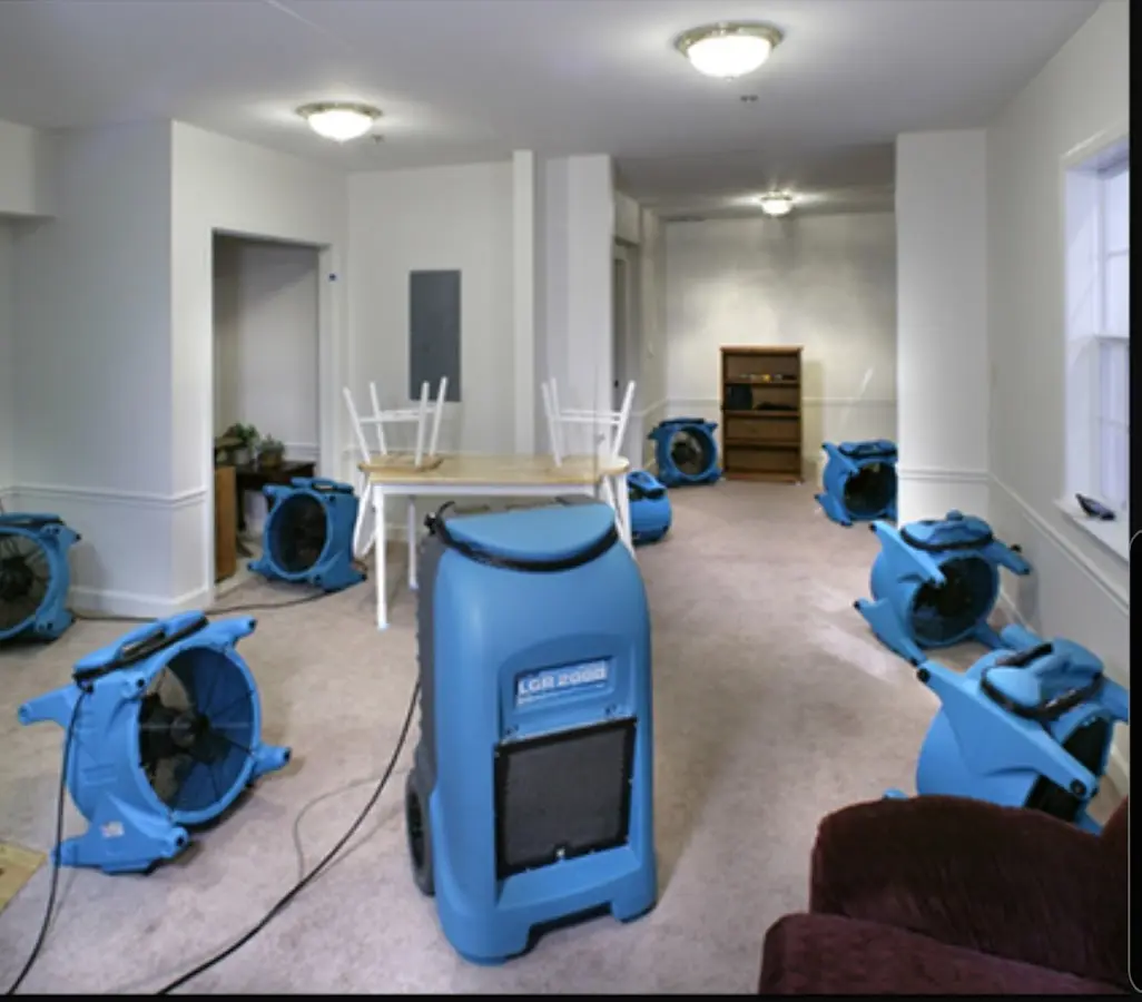 Air movers and dehumidifier setup for Water Damage Restoration in Webster